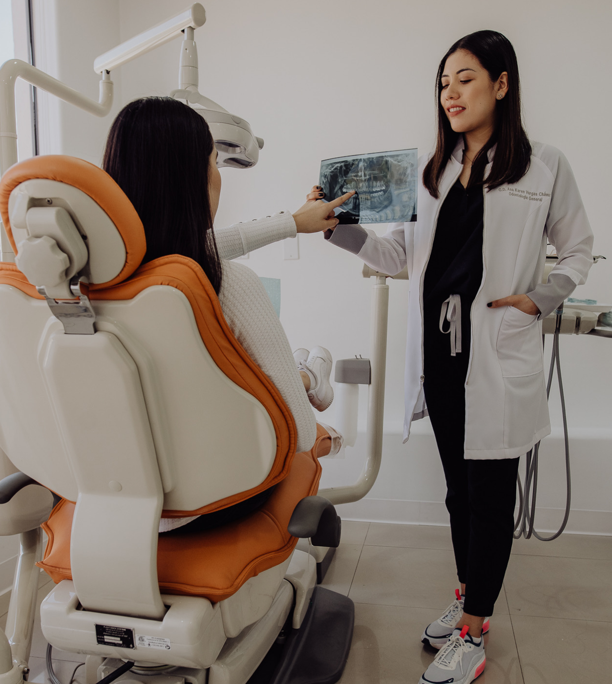 Dentist (Ana K.) attending a patient